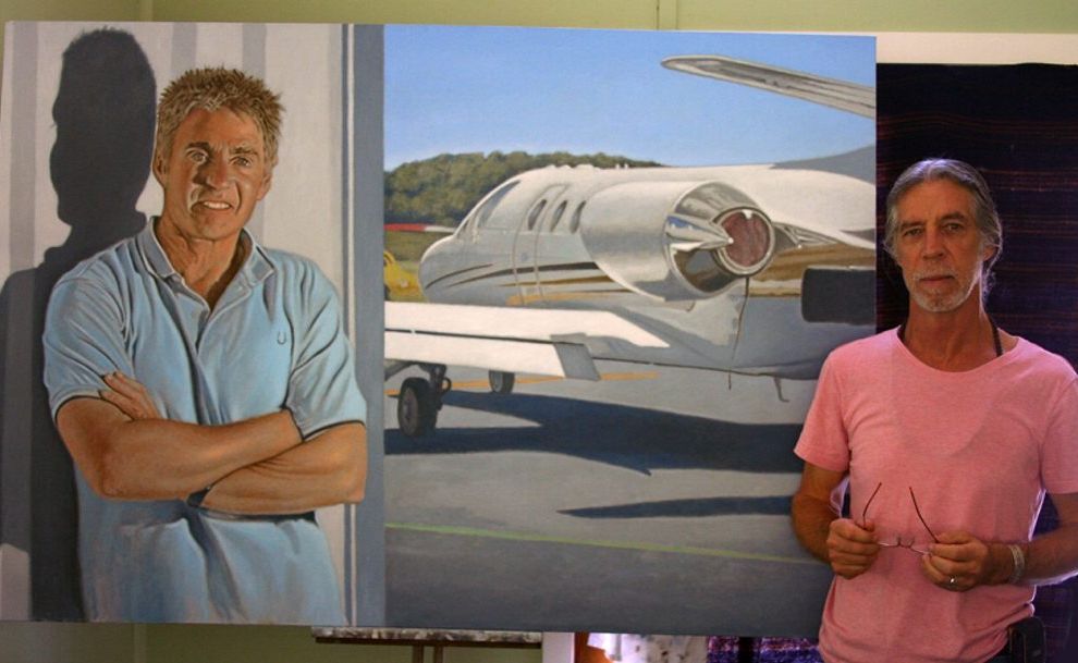 Part-time weed management officer Raymond Cheney with his portrait of Mick Doohan. Part-time weed management officer Raymond Cheney with his portrait of Mick Doohan.